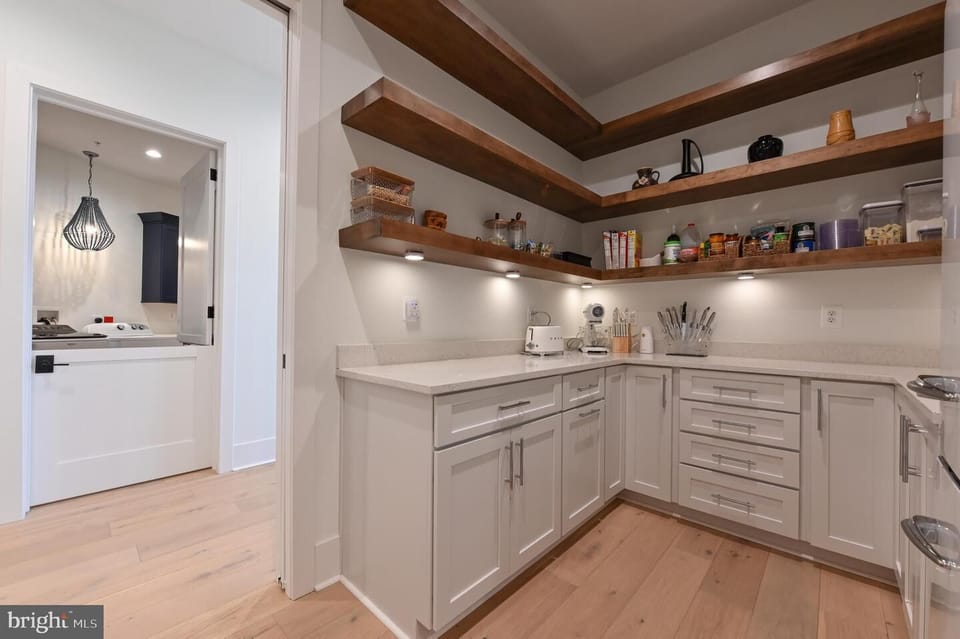 Walk in pantry/coffee bar behind kitchen