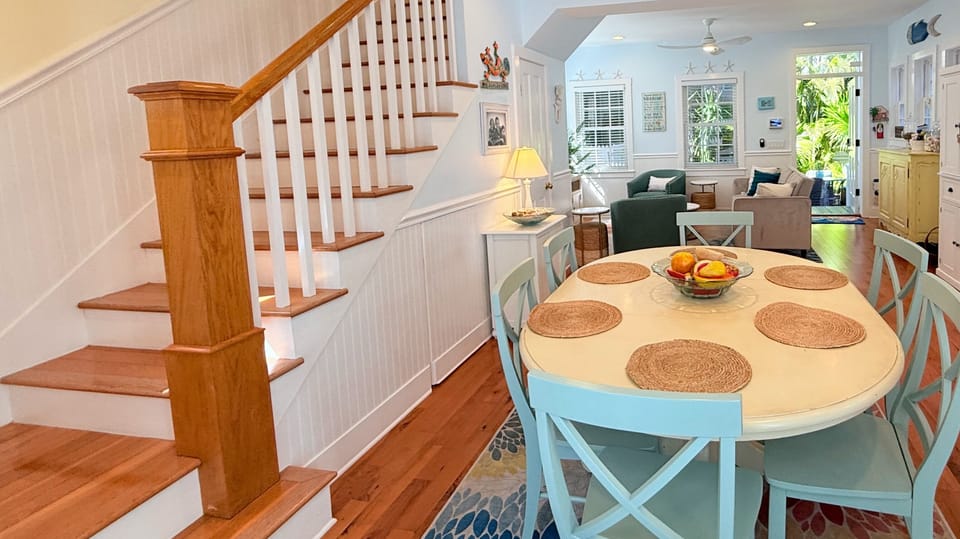 Just off the dining area, a staircase invites you upstairs to two cozy bedrooms—offering a natural flow from shared living spaces to peaceful, private retreats above. ✨
