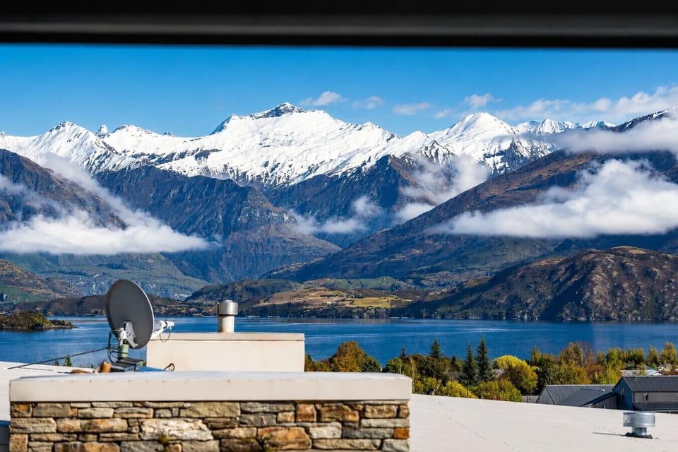 That view never gets old - snow-capped peaks and shimmering lake, yours for the stay