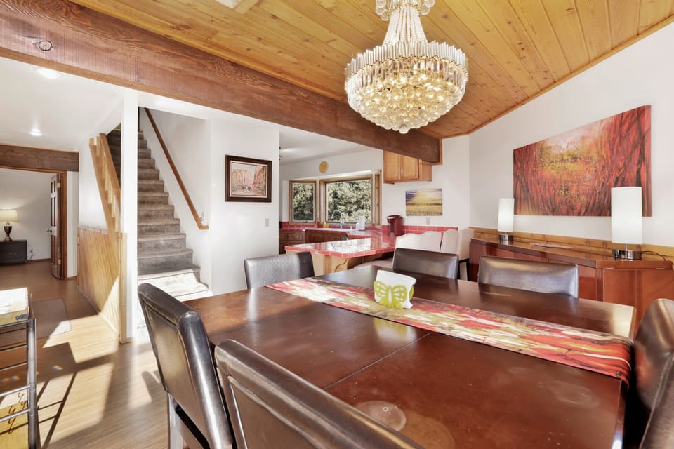 Inviting dining area with elegant table setting, warm lighting, and welcoming atmosphere perfect for shared meals