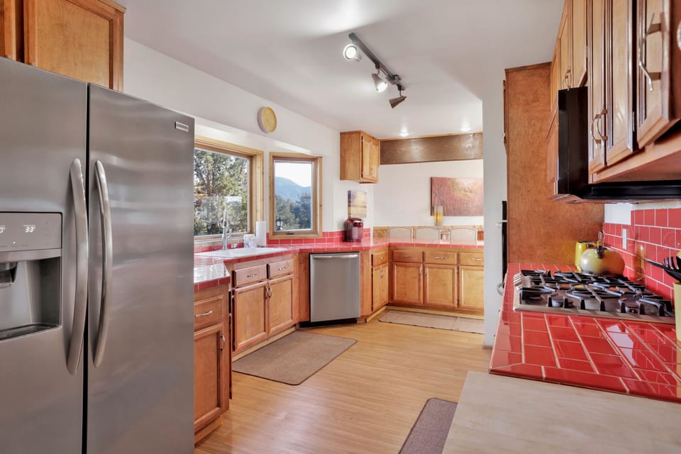 Modern kitchen with sleek appliances, spacious counters, and inviting design ideal for cooking and entertaining