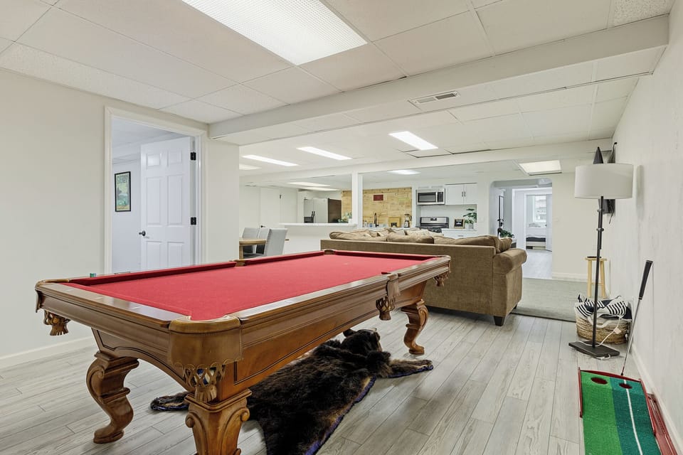 Spacious game room w/ pool table & open layout for laid-back fun.