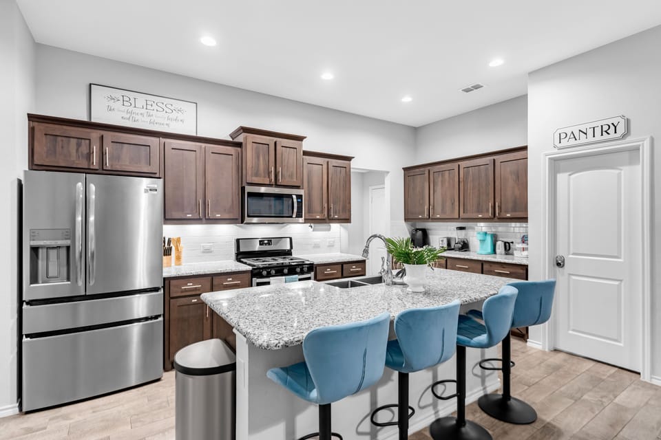 Kitchen with bar stools.