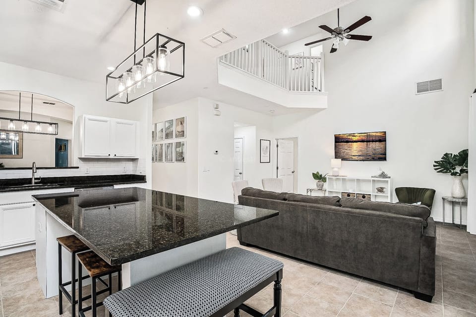 Spacious open-concept living area with modern design, perfect for relaxing and entertaining.