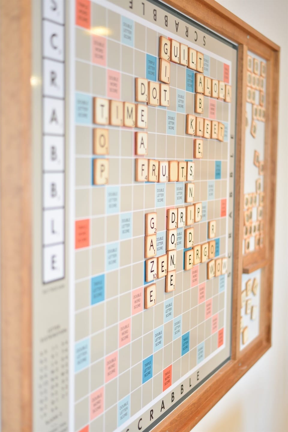 Massive wall Scrabble board + full library of books and board games for cozy nights in