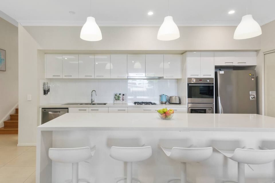 A generous kitchen has all you need to cook up a feast, with seating at the breakfast bar and a dishwasher for easy clean-up. 
