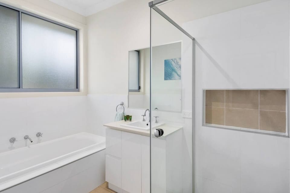 The bathroom features a vanity and a shower, as well as a bathtub where you can end the day with a leisurely soak. 
