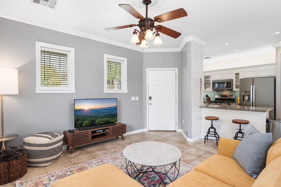 The living room, kitchen and dining table are downstairs. It's an open concept space so everyone can hang together and be in the mix.