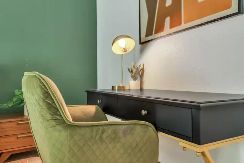 Cozy desk with a lamp – perfect for productivity or a peaceful book escape.