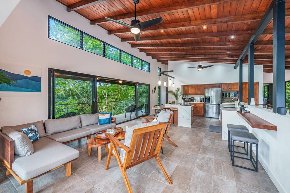 Living area and kitchen connected to outdoor terrace