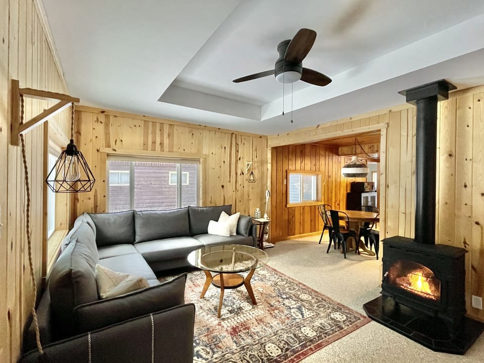 Cozy cabin with easy-to-use, flip-a-switch indoor gas stove fireplace.