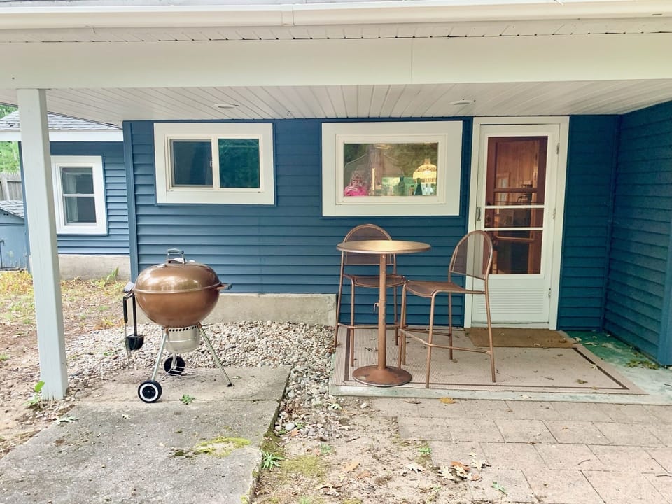 Charcoal grill and small bistro set.