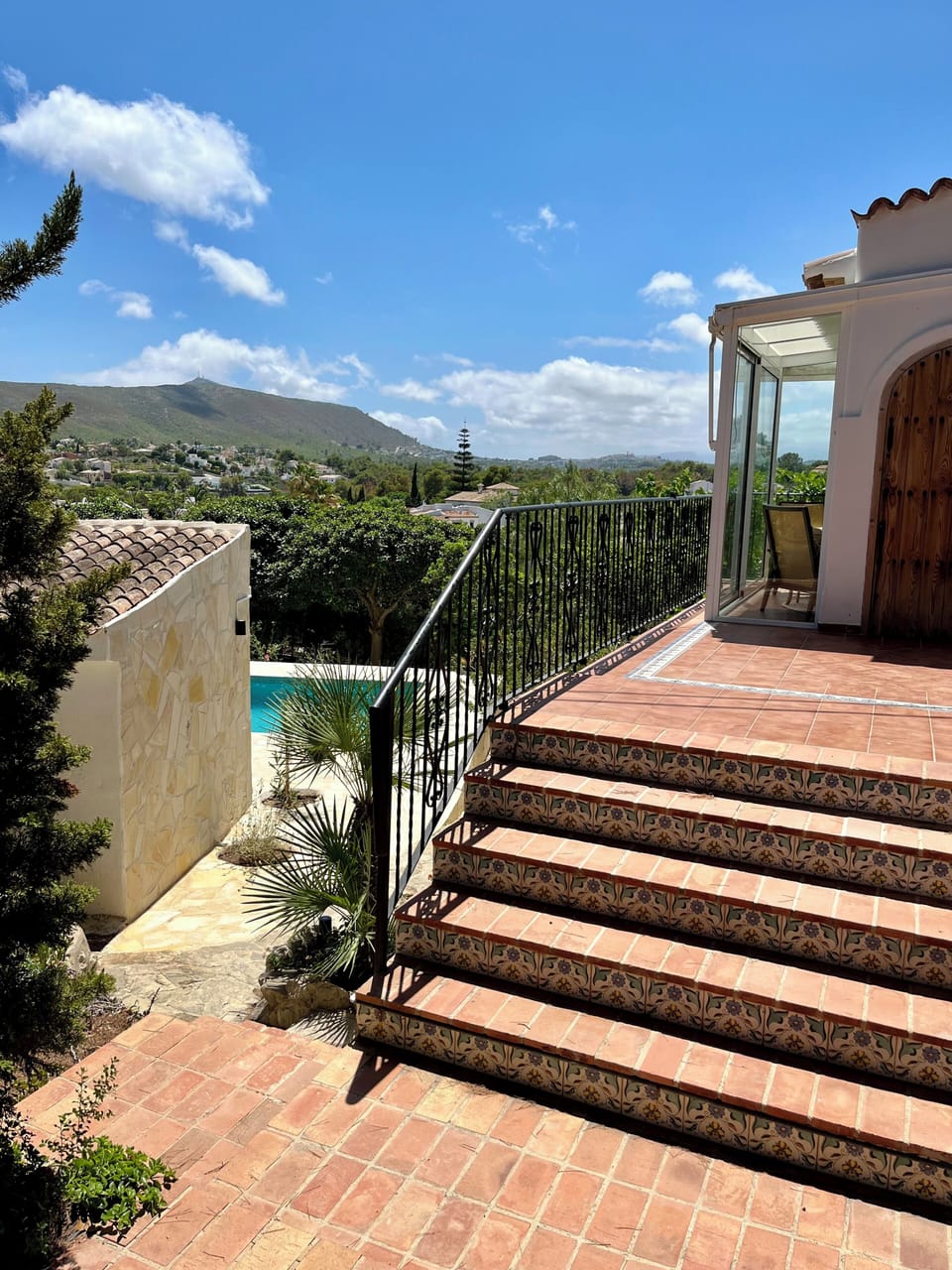 Stairs up to the main level or down to the pool and ground level rooms