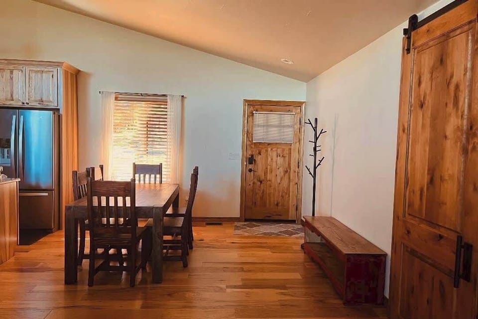 Entryway with bench for removing shoes and coat rack.