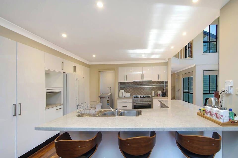 A modern kitchen makes it easy to prepare meals at home, with quality appliances and cooking utensils.
