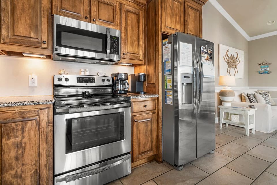 Fully equipped kitchen with rustic wood cabinetry and modern appliances