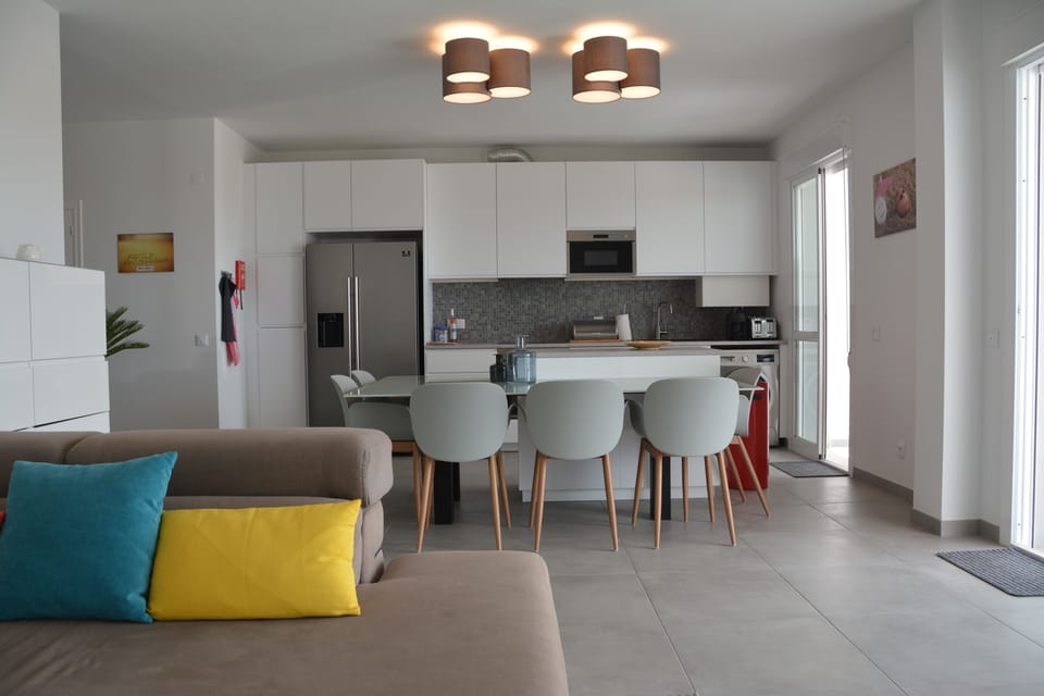 Dining room with fully equipped open plan kitchen