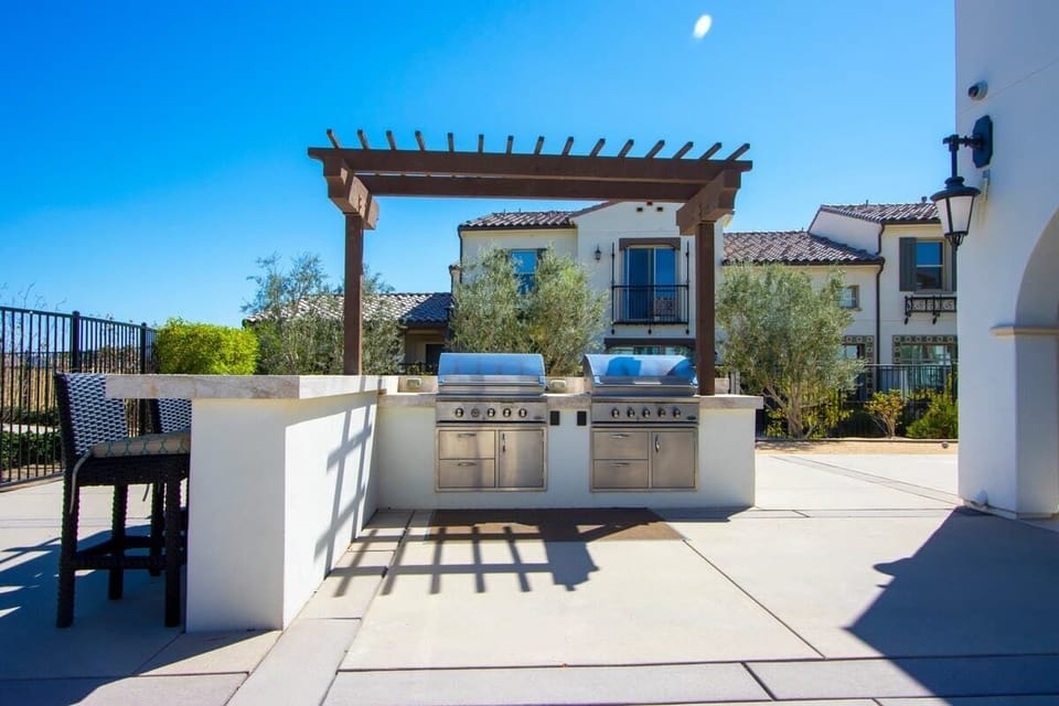 Grill burgers on the stainless steel barbecues by the pool.