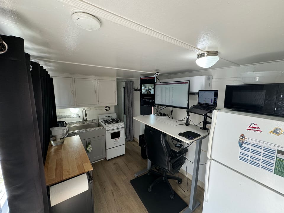 View from Front Door Towards Kitchen Area, Refrigerator/Freezer, Microwave