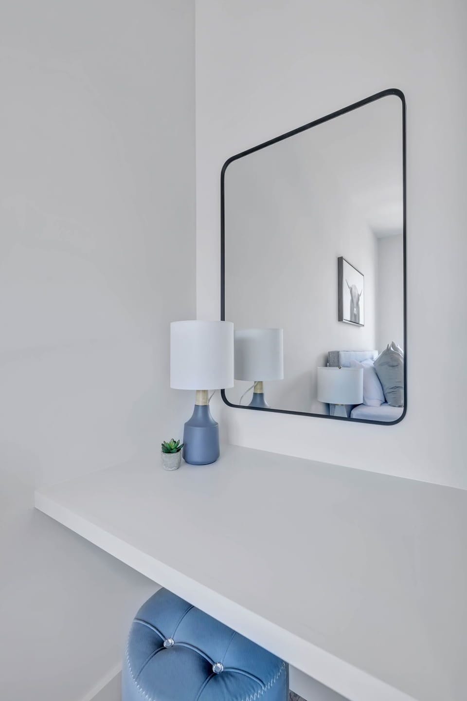 2nd Bedroom with Queen bed, closet space, vanity, and smart TV.