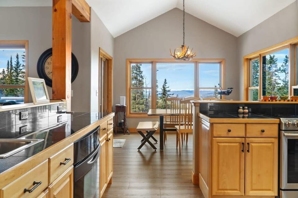 The view into the bright kitchen and dining room from the entryway.