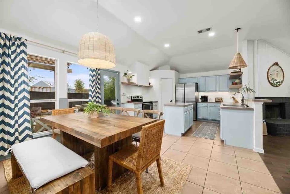 Unlock the potential for unforgettable dining experiences in a kitchen and dining space that seamlessly blends interior elegance with exterior beauty.