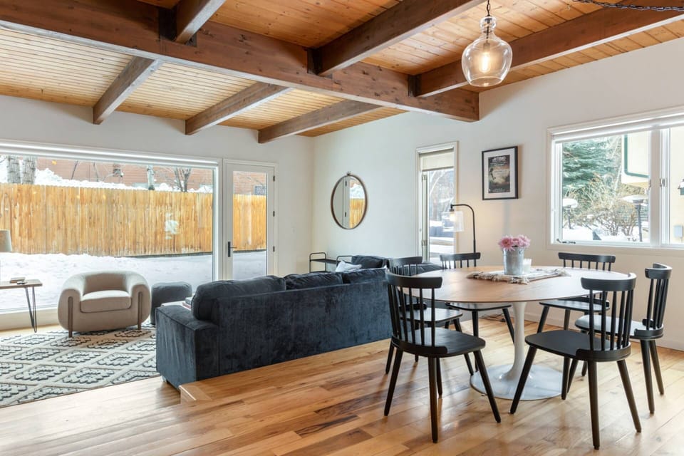 The open dining area invites you to enjoy a delicious meal while staying connected to the cozy ambiance of the living room.