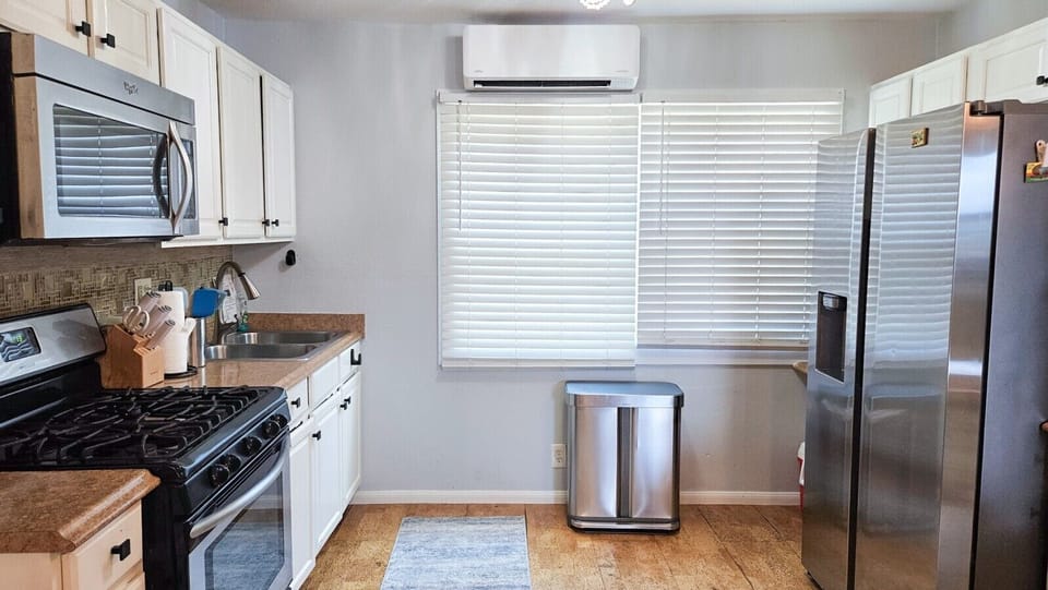 AC in the kitchen keeps it and the living room at a comfortable temperature