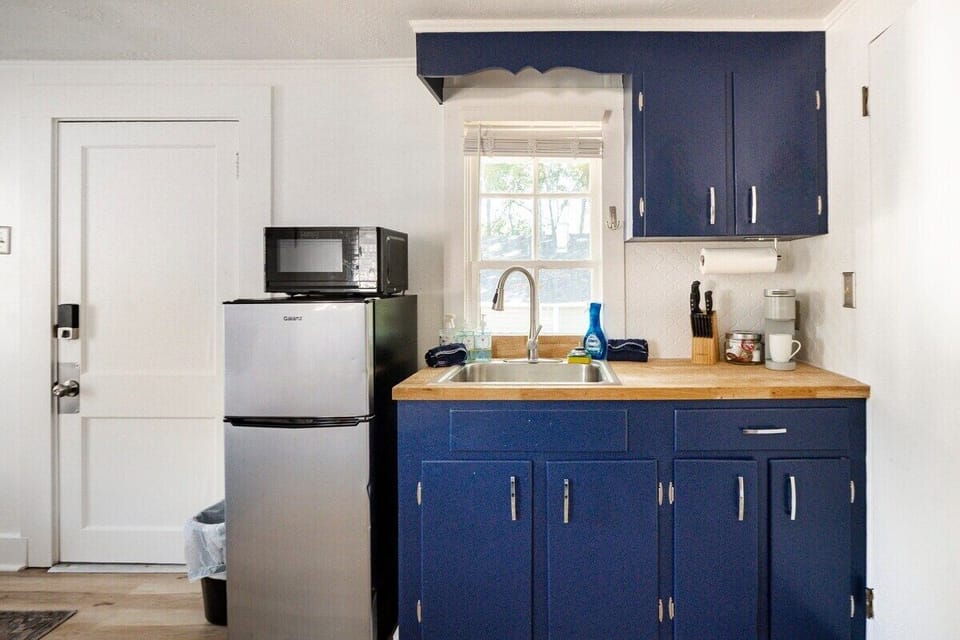 This is our lovely kitchenette, complete with fridge, microwave, and cooktop