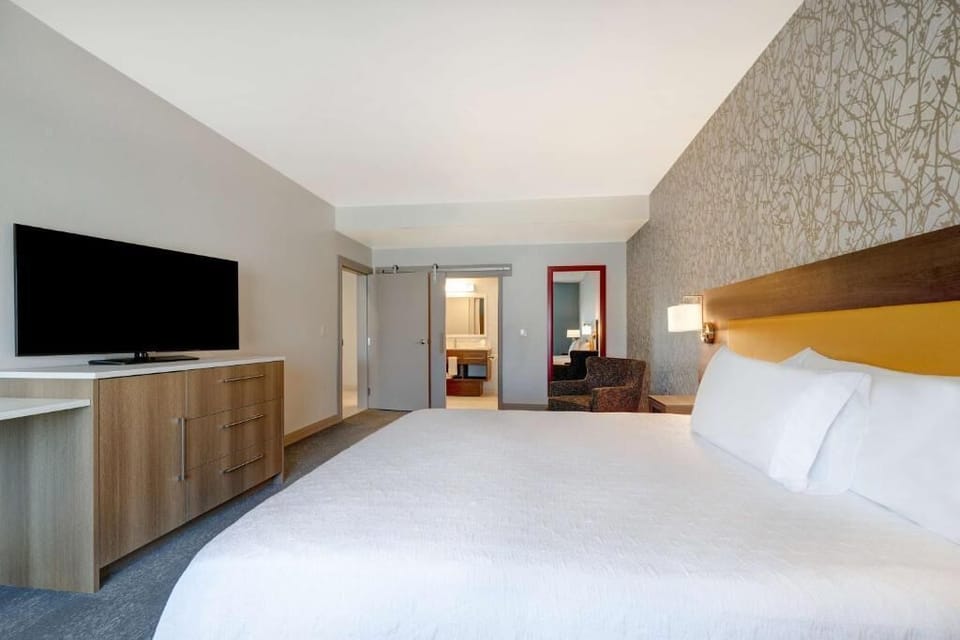 Unwind in a bright king room with crisp linens.