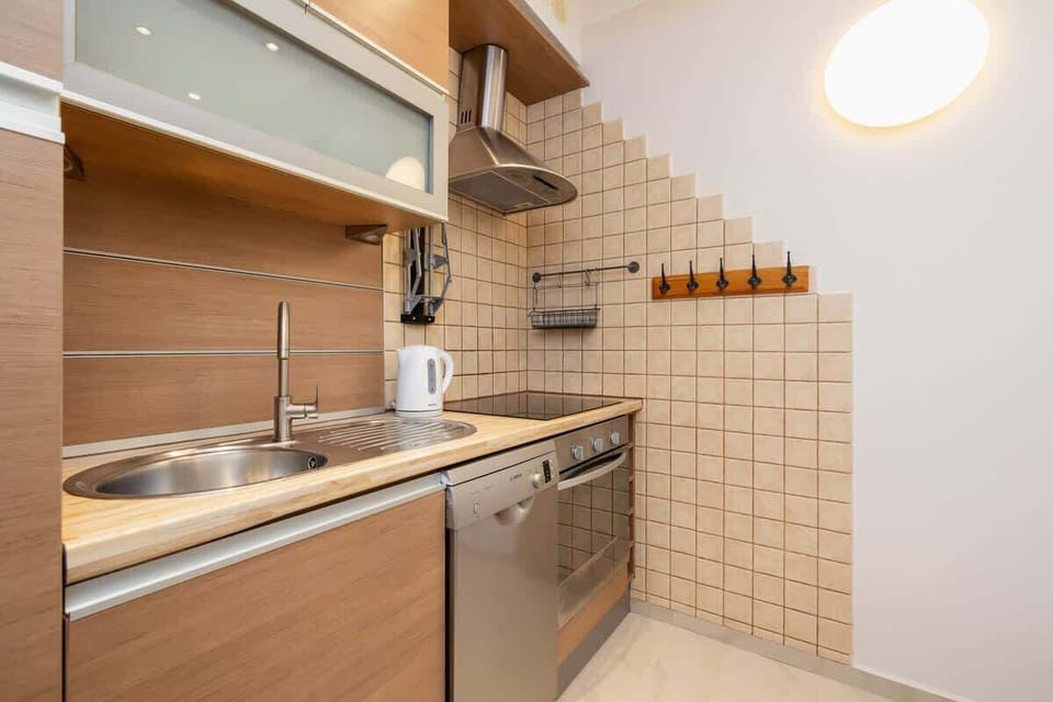 The kitchen offers a functional layout for convenient cooking. 