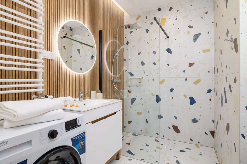 The bathroom's stylish design provides a relaxing environment. 