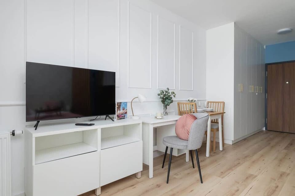 The living area's modern and stylish decor creates a welcoming atmosphere. 