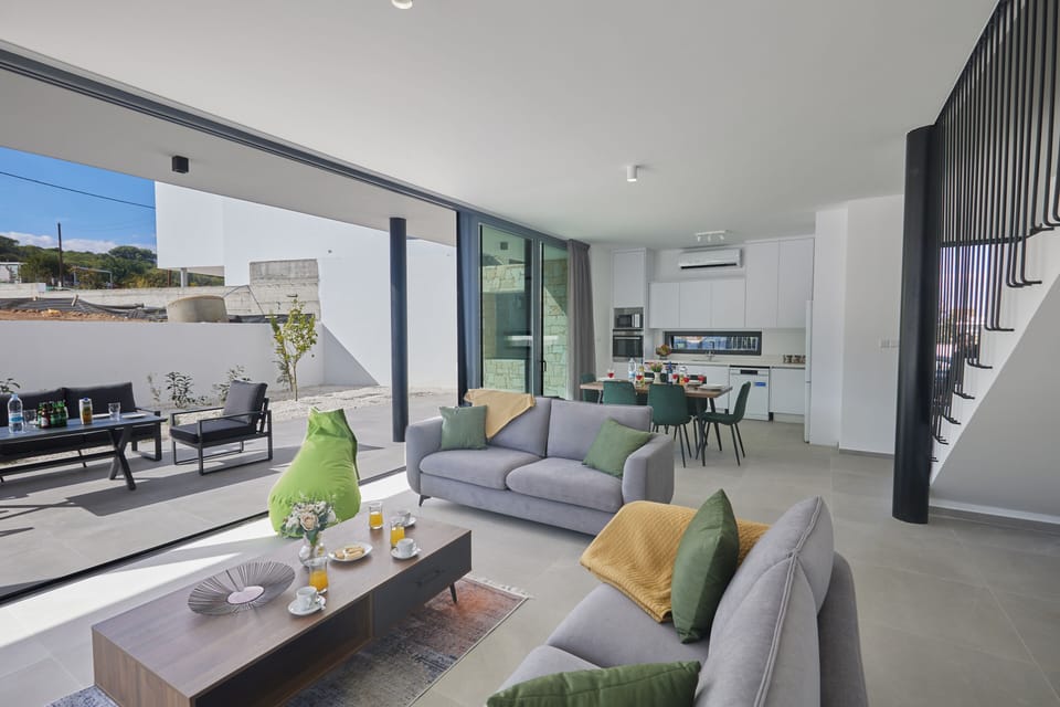 Ground floor surrounded by large bi-fold patio doors leading to the garden 