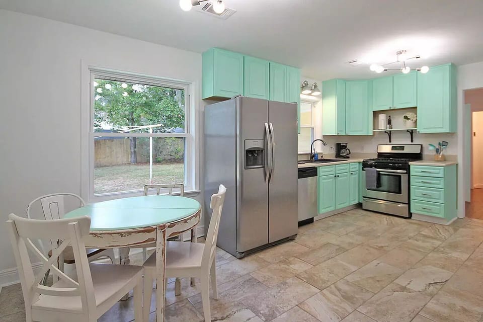 Beachy kitchen fully equipped with dining, utensils and glassware for 8 guests.
