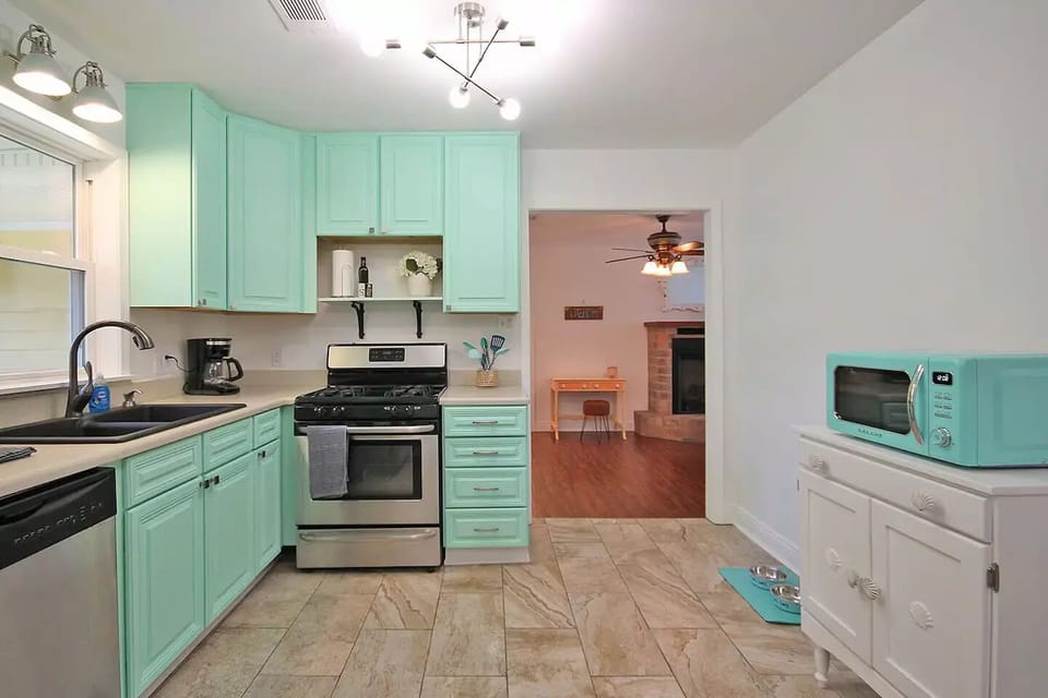 Appliances include a full size refrigerator, gas stove, microwave and coffee pot