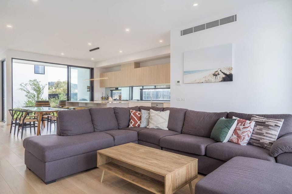 The spacious living area features a large corner sofa and chaise to settle in with a movie.