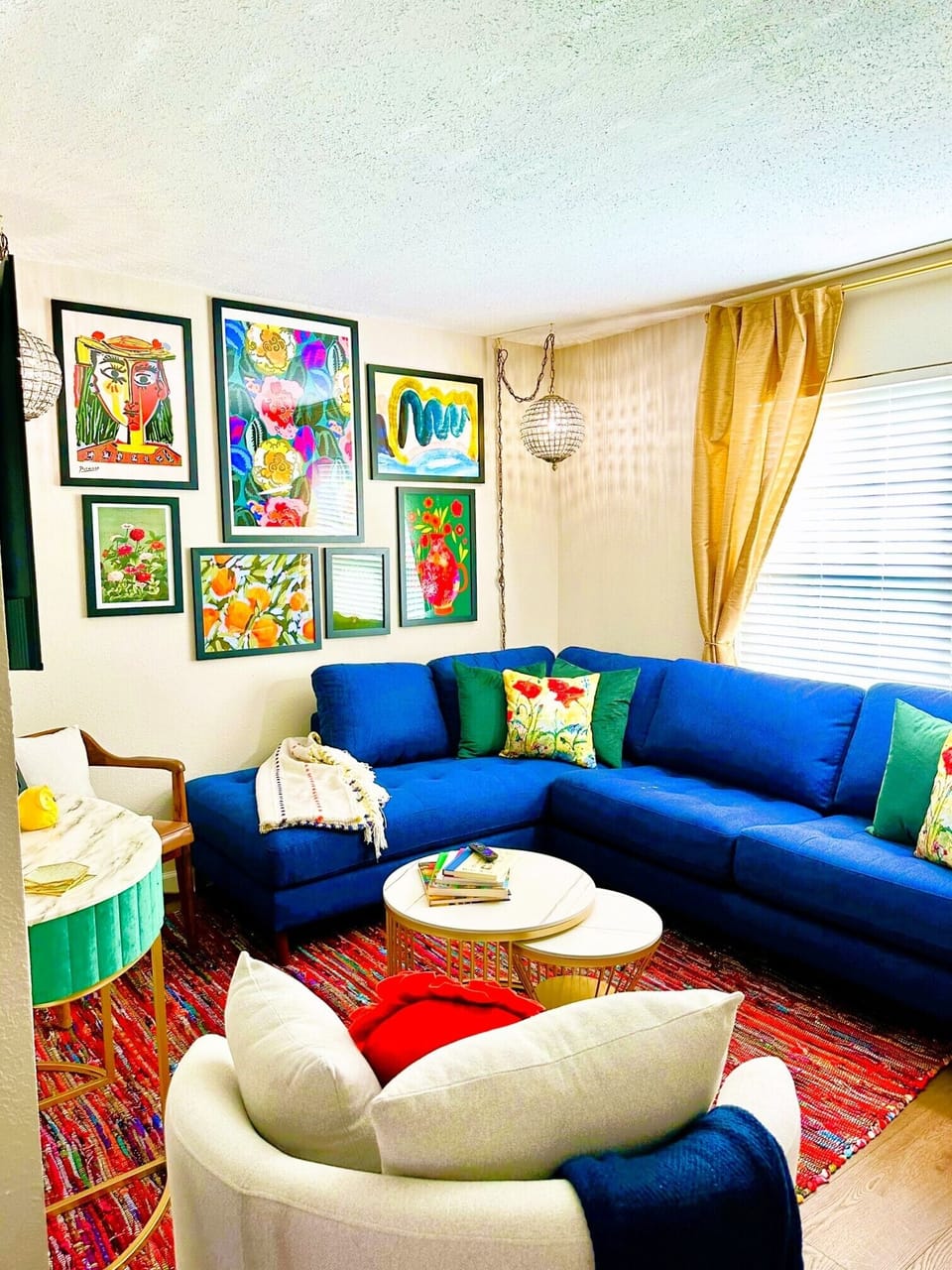 Spacious living room with multiple seating options, smart tv, and sofa bed