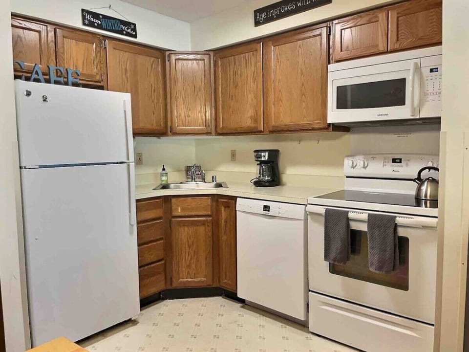Our modern kitchen is adorned with a touch of white and rustic style.