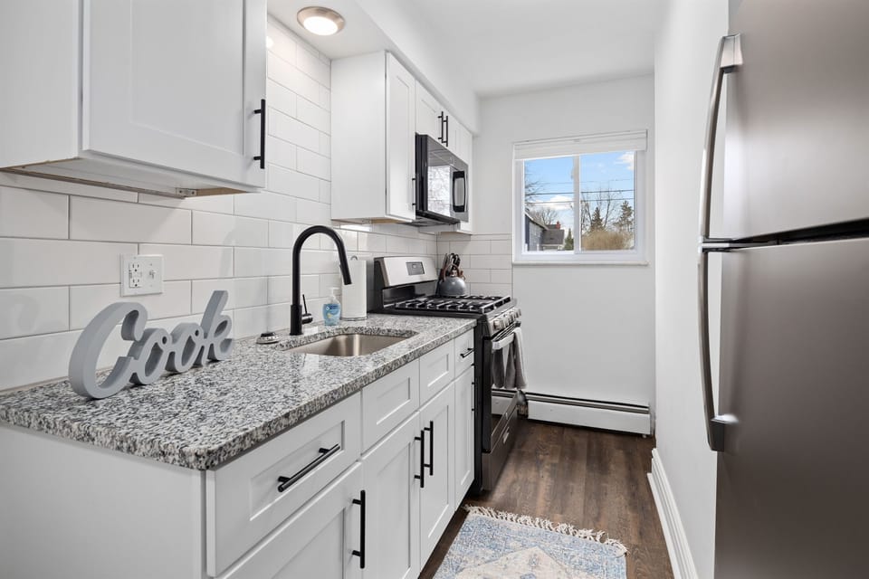"Wake up to the sound of the rain falling outside, as you relax in this luxurious bathroom with a walk-in shower and marble countertop."