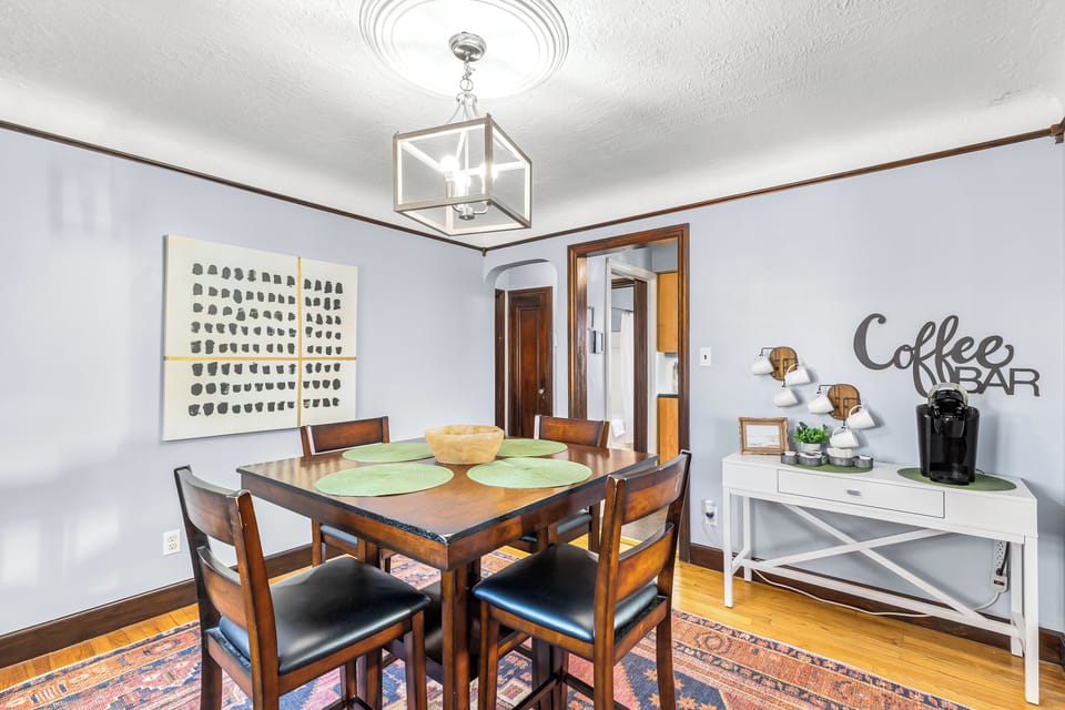 Start your day off right with a delicious breakfast in this cozy dining room. The warm lighting and hardwood floors will make you feel right at home.