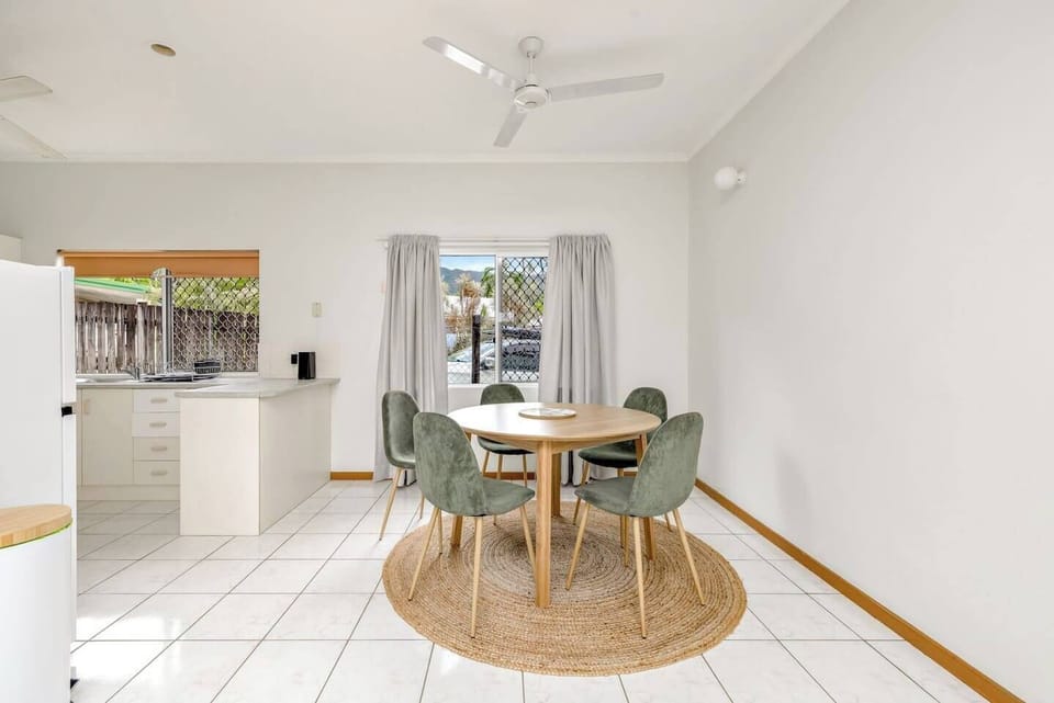 A light and airy dining area includes a five-seater table where you can share meals.
