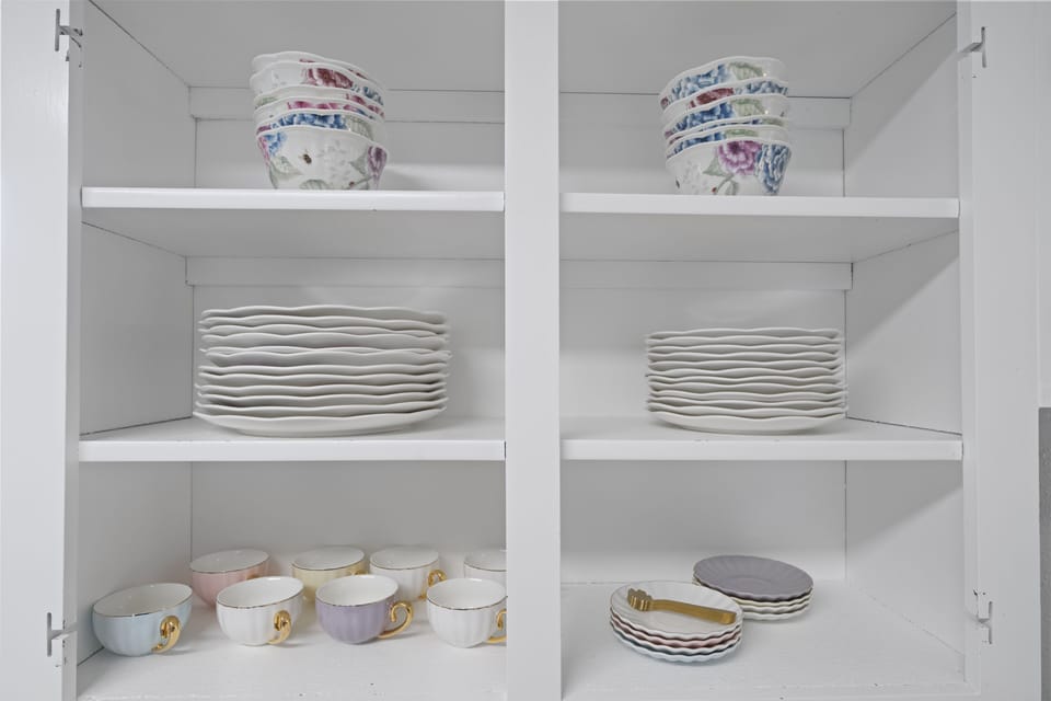 More dishware and at the cupboard