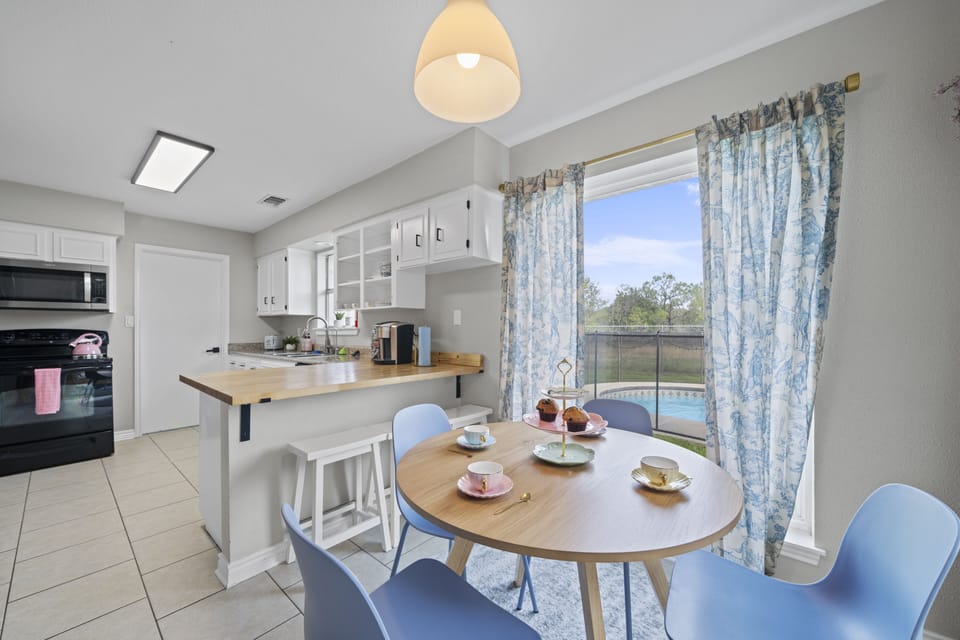 Conversation nook for 4 with tea party set; adjacent to the kitchen