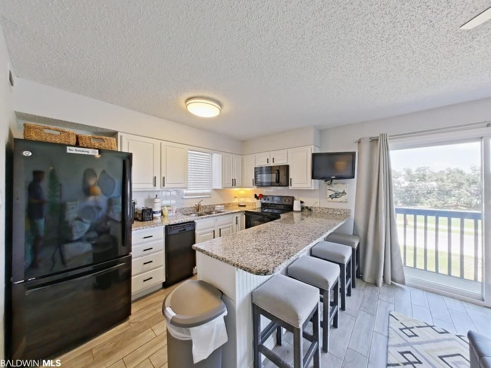 Fully stocked kitchen with dining area
