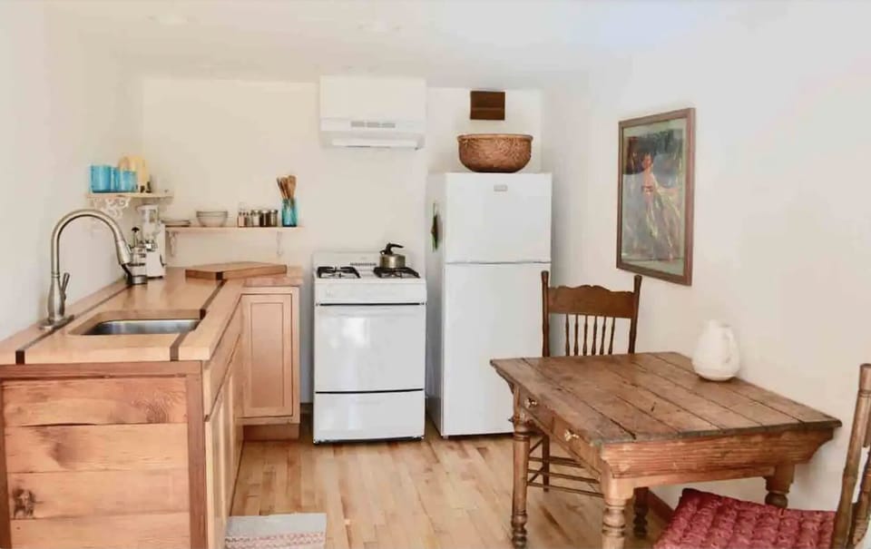 Full kitchen with four burner gas stove and oven. 
