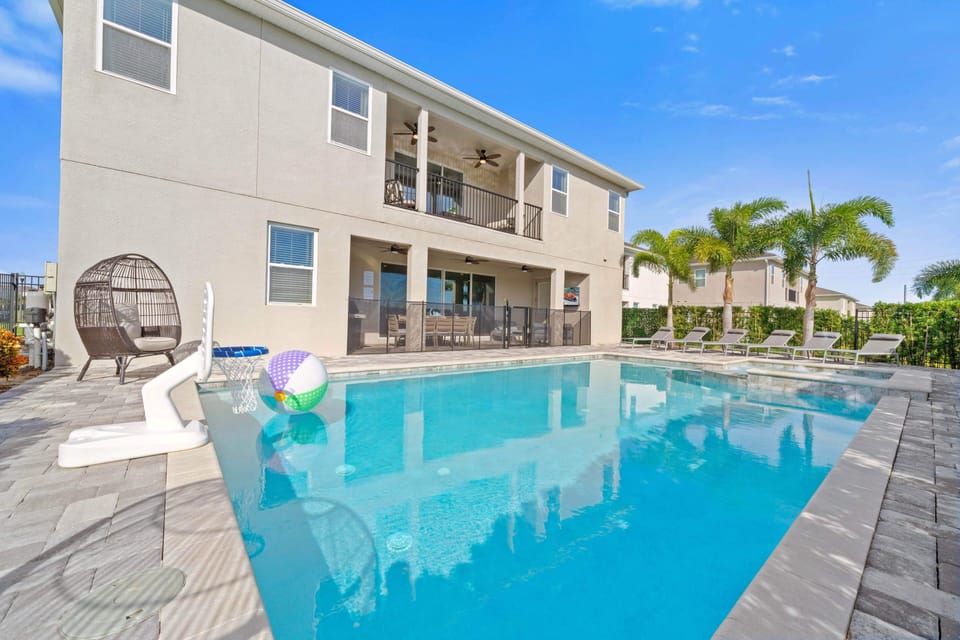 - Sparkling private swimming pool with sun loungers for family vacations in Florida  
- Enjoy games poolside with basketball hoop and beach ball under the sunshine  
- Orlando vacation rental designed for fun relaxation and theme park adventures