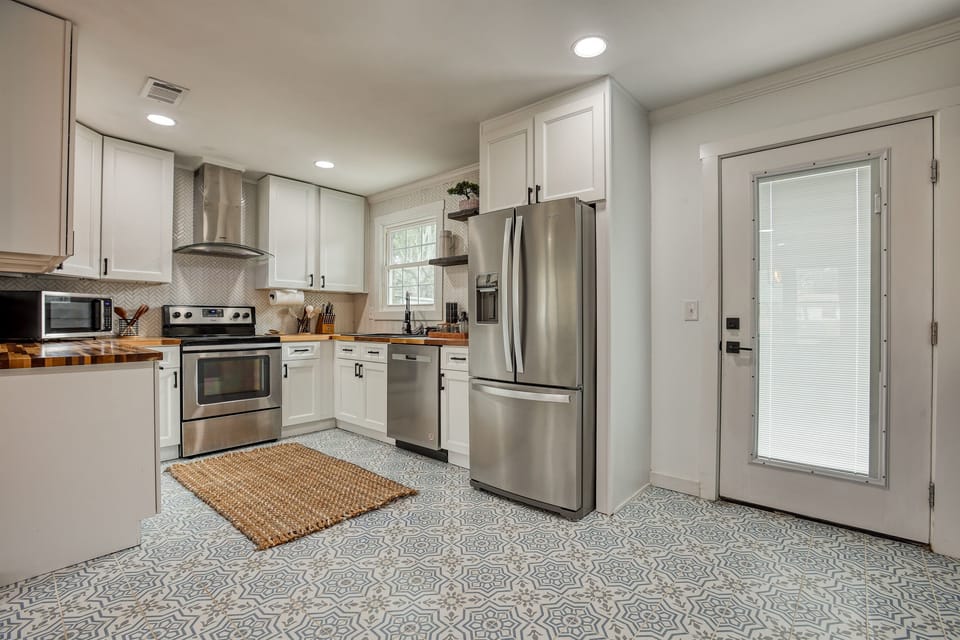 Overview of the kitchen and dining area in Savannah Coastal Charm, featuring modern appliances and a spacious layout for family meals and gatherings.