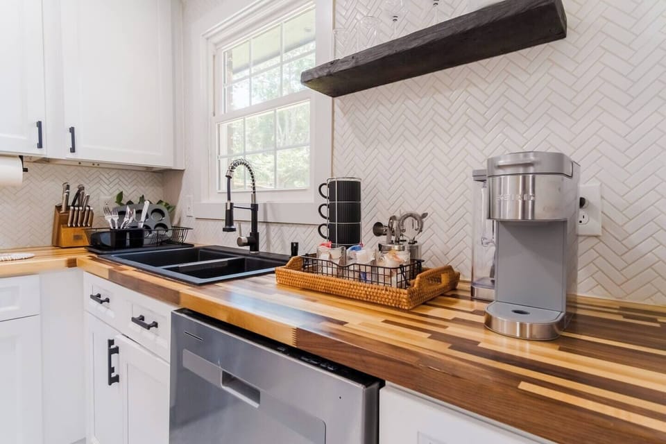A well-appointed coffee station complete with a modern coffee maker and an assortment of coffee accessories, perfect for morning routines.
