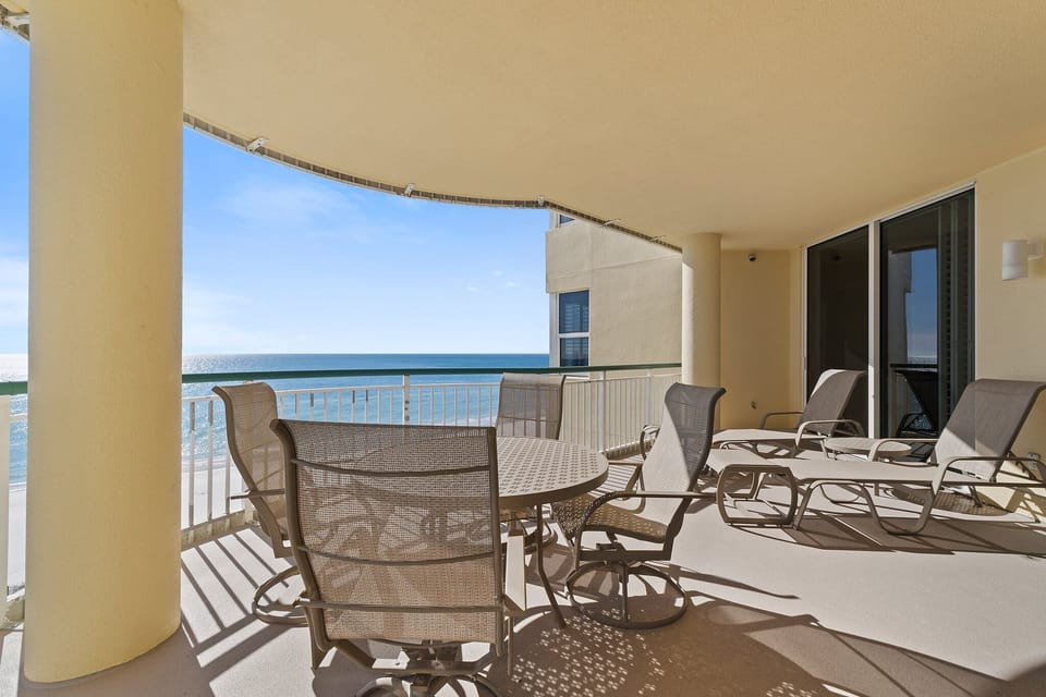 Dine al fresco on the private balcony at Beach Colony East 6B